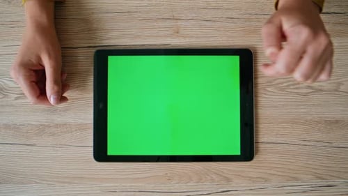 Employee Hands Swiping Mockup Tablet on Desk Closeup Top View Unknown Woman