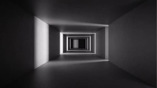 Light and shadows move through the endless tunnel with concrete walls.