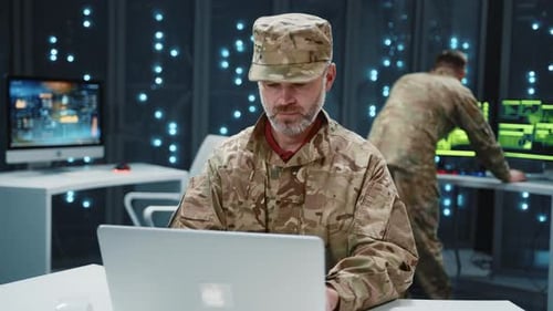 In Data Center Bearded Military Officer Working on National Cyber Security Data Information at
