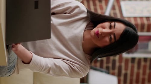 Woman Uses Laptop Computer at Home