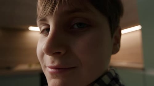 Close-Up of Smiling Young Boy Indoors