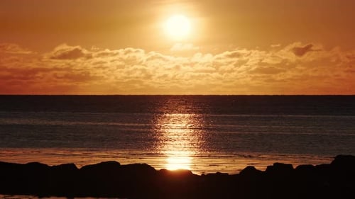 Dramatic Sea Sunset Burning Sky and Shining Waves Warm Clouds and Pure Ocean Water at Sunrise Blue