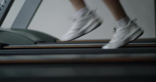 Athletic Woman Running on a Treadmill in Modern Gym Fit Girl Doing Cardio Workout on a Running