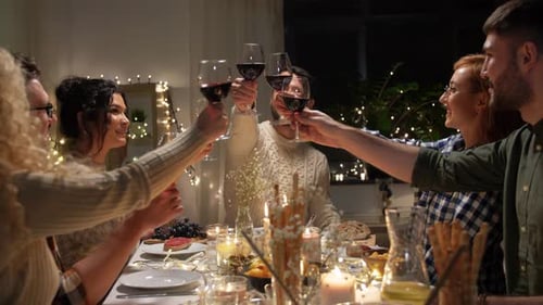 Friends Toasting Wine at Dinner Party Celebration