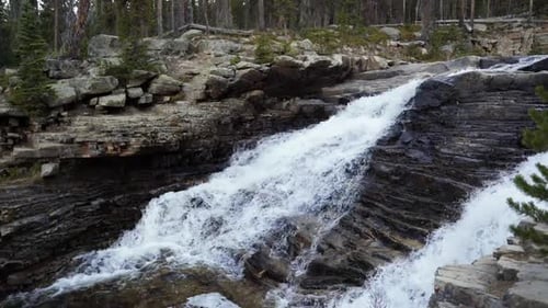 The beautiful Provo Falls waterfall in the Uinta Wasatch Cache National Forest in Utah on an overcas