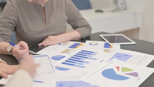 Close up of Women Working on Documents at Work