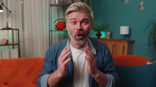 Adult Man Gesturing and Communicating Indoors