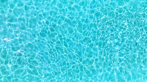Blue Water in the Swimming Pool with Light Reflections Slow Motion