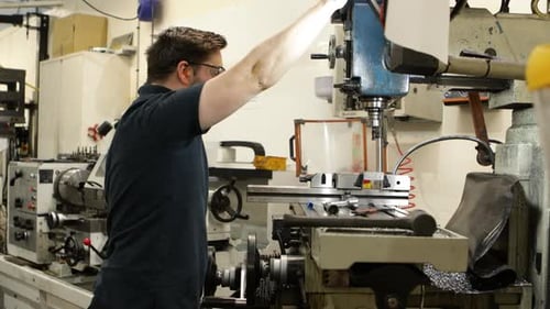 Caucasian Worker Operating A Milling In industrial Workshop