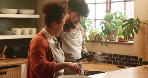 Couple Cooking Together in a Bright Kitchen