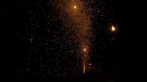Sparkling Fireworks Fountain Display Against Dark Night Background