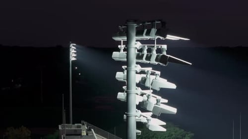 Light Tower of a Stadium and a Night City Close Up View