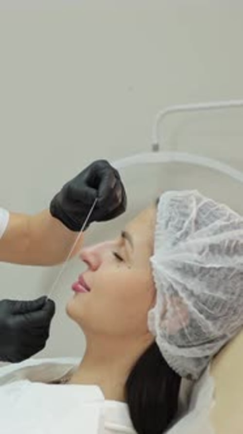 Woman Receiving Medical Cosmetic Procedure in Clinic
