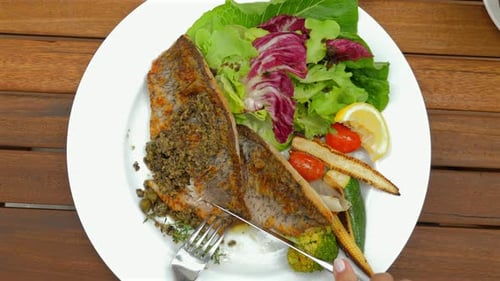 Grilled Fish with Mixed Greens Cherry Tomatoes Baby Corn and Lemon