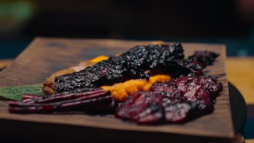 close-up of a dish pieces of juicy roasted duck with puree on a plate Asian cuisine restaurant