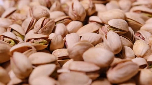 A Delightful Close Up of Fresh Shelled Pistachios Showcasing Their Vibrant Green Color