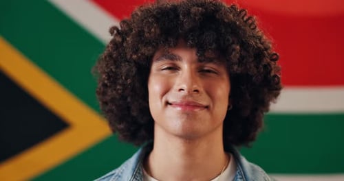 Smiling Young Adult Portrait with Flag Background