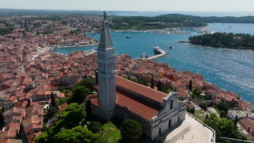 Drone view of the cathedral of St. Euphemia and the old town of Rovinj in the background. Located in