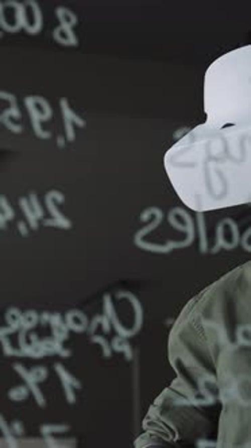 Software Developer Testing App with VR Headset in Office