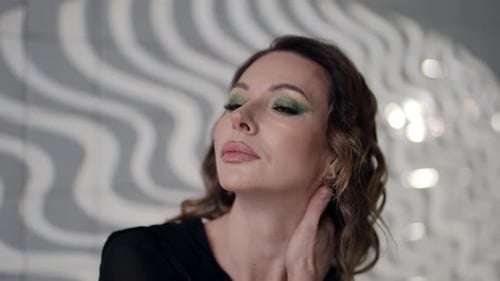 Real Middleaged Woman with Professional Fashion Makeup and Hairstyle Portrait in Studio