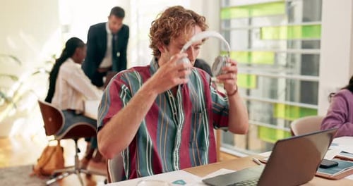 Laptop, man and headphones for college assignment, typing and research for studying module