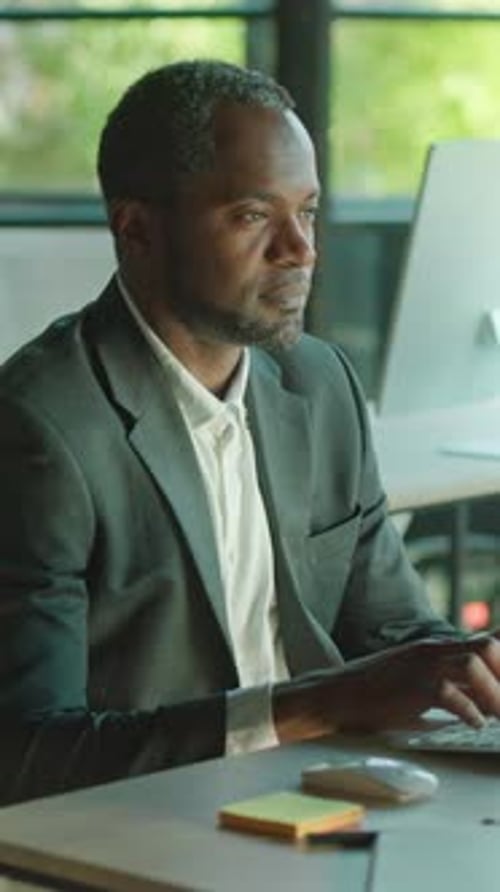 Man working at computer in office daytime
