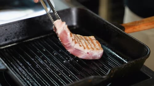 Chef Cooking a Steak in Restaurant Kitchen Close Up