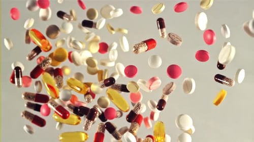 Colorful Pharmaceutical Pills and Capsules Floating