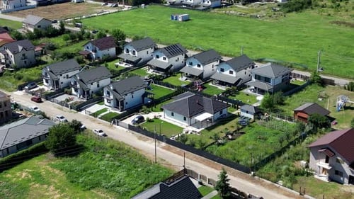 aerial orbit of large luxury single-family homes in Romania