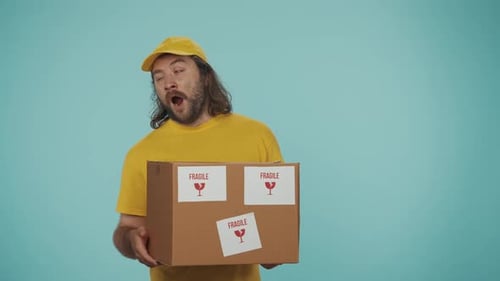 Sleepy Delivery Man Awakens Holding Fragile Box