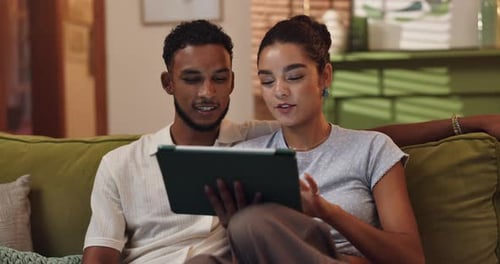 Browsing, watching and couple with tablet, date and bonding with entertainment