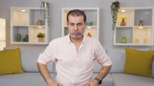 Man looking at camera with a negative expression.