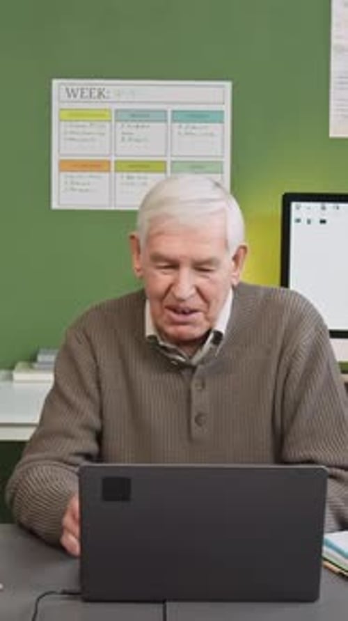 Vertical Shot of Senior Man Chatting in Computer Literacy Class