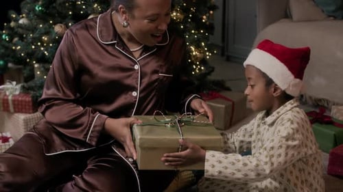 Mother and Child Exchanging Gifts at Christmas