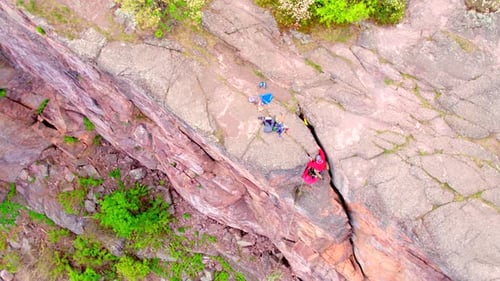 Rock Climbers Climb Down Rocky Cliff, Aerial Drone
