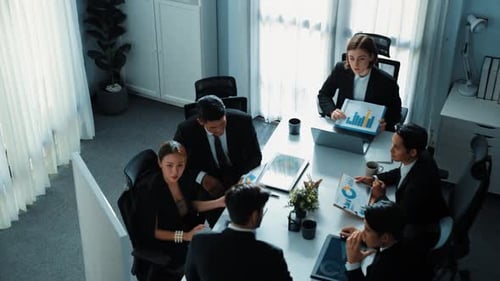 Top view of manager holds chart while businessman explains idea. Directorate.