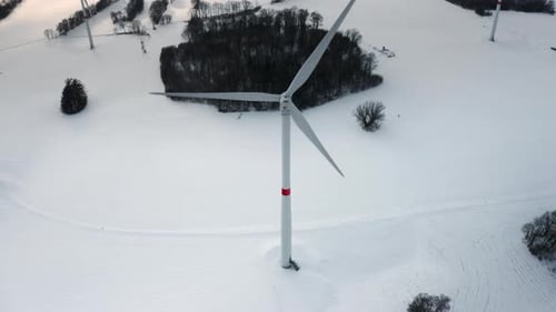 A Wind Turbine Park in the Winter Field As a Hub of Renewable Energy Production