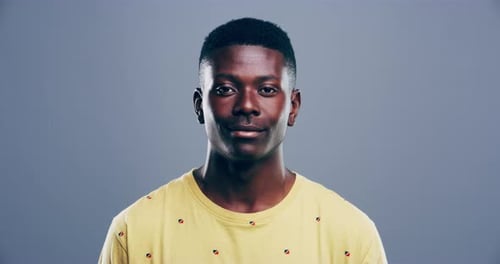 Young Man Smiling Directly at the Camera