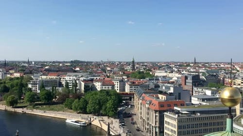 Berlin Skyline with a view of a train and the Spree river