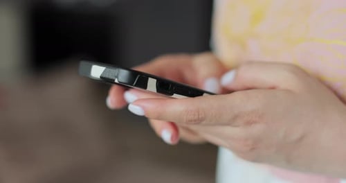 Hands Holding and Texting on Mobile Cell Phone