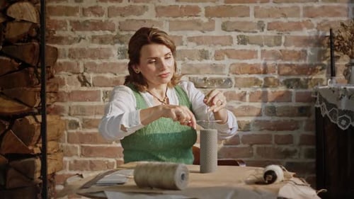 Adult Woman Makes Candles From Wax in a Home Handmade Workshop