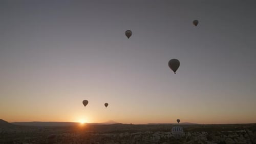 Aerial View of Hot Air Balloons at Sunrise