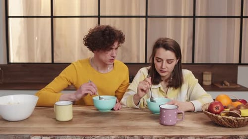 Couple Eating Breakfast Together at Home
