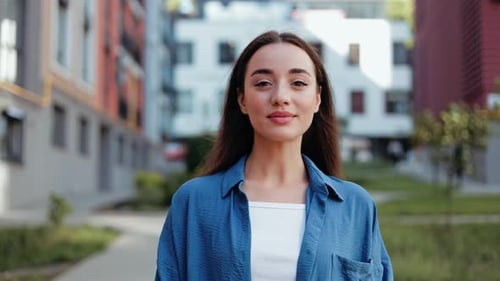 Smiling Young Woman in Urban Setting
