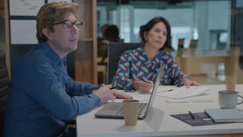 Male CEO Leading Office Meeting with Board of Directors