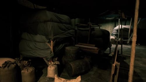 Rustic Old Warehouse Interior with Sacks and Cart