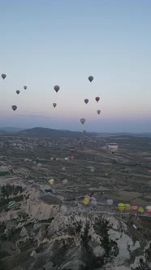 Aerial video over monoliths in Cappadocia, on hot air balloons, Turkey