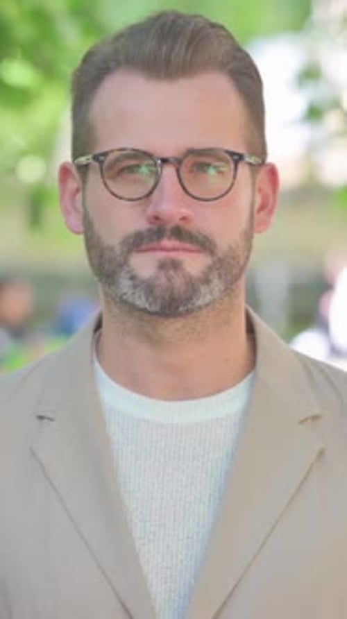 Portrait of Serious Businessman Outdoor in Park, Vertical Video