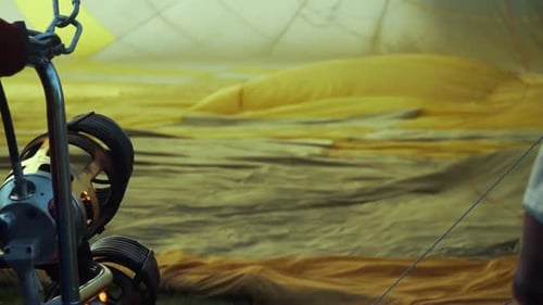 Inflating Yellow Hot Air Balloon with Flames