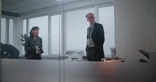 Office Robbery Case Female Criminalist Takes Photos of Evidence Then Talks to Male Detective